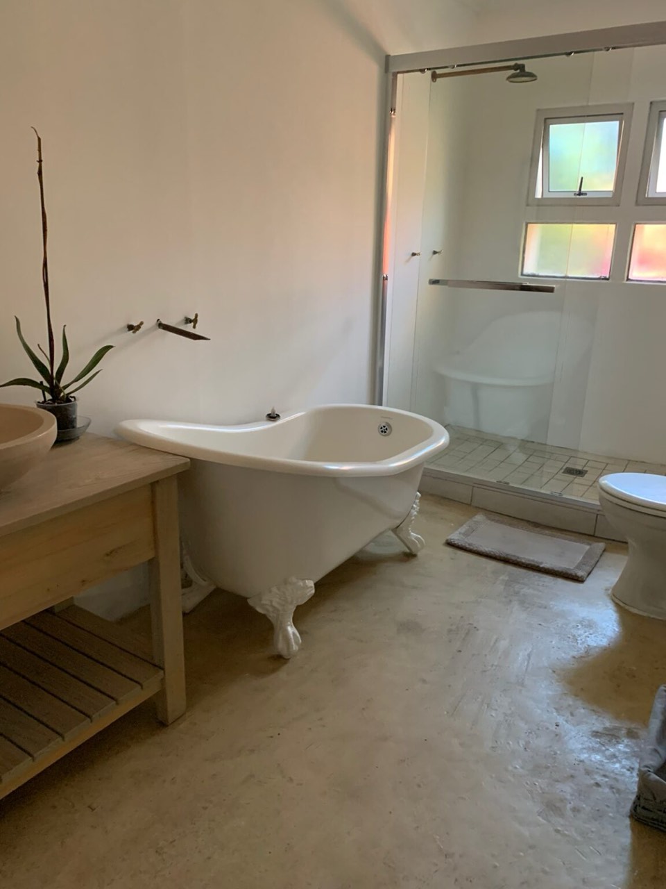 Bathroom with freestanding clawfoot bathtub