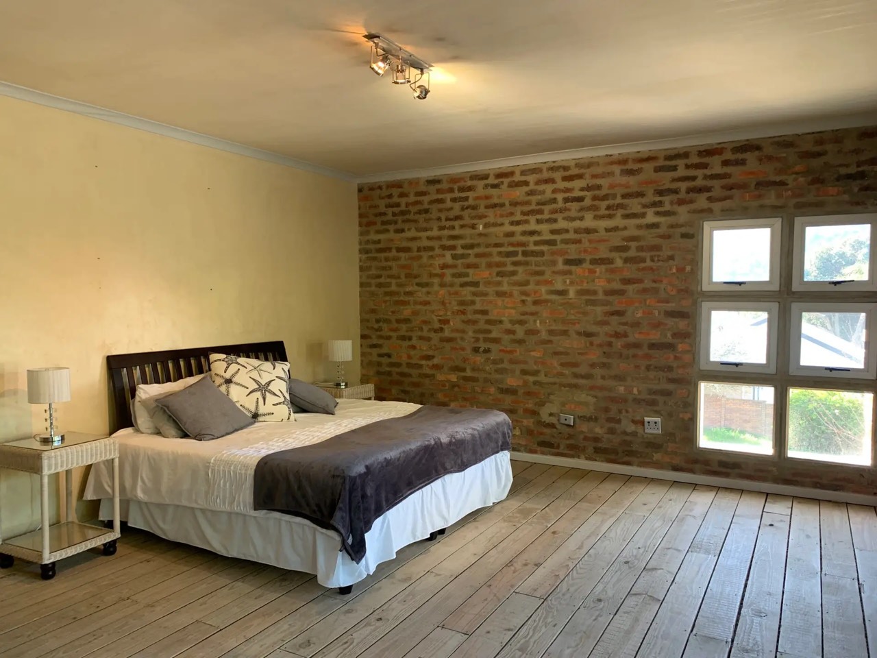 Bedroom with exposed brick feature wall