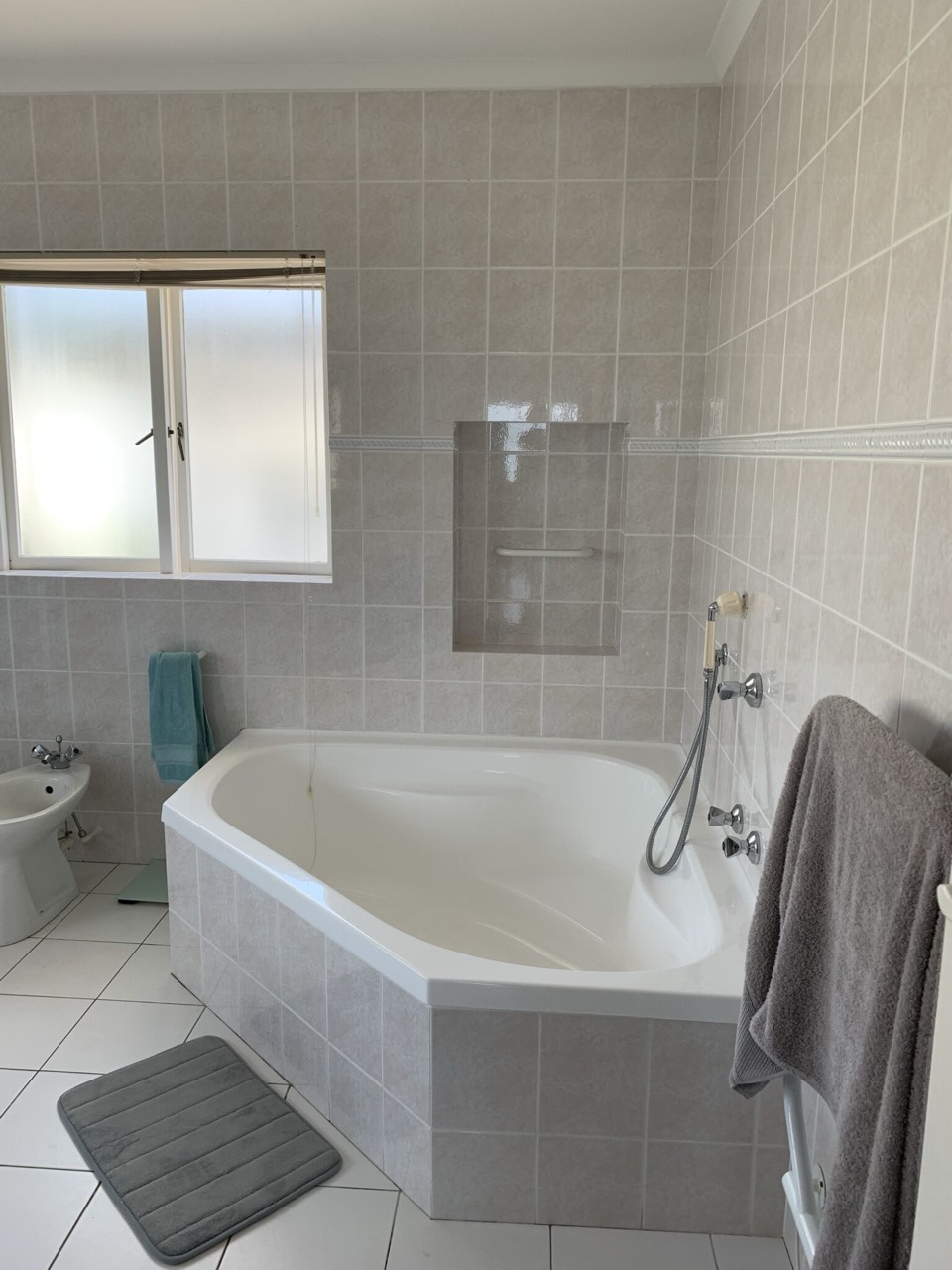 Bathroom with corner bathtub