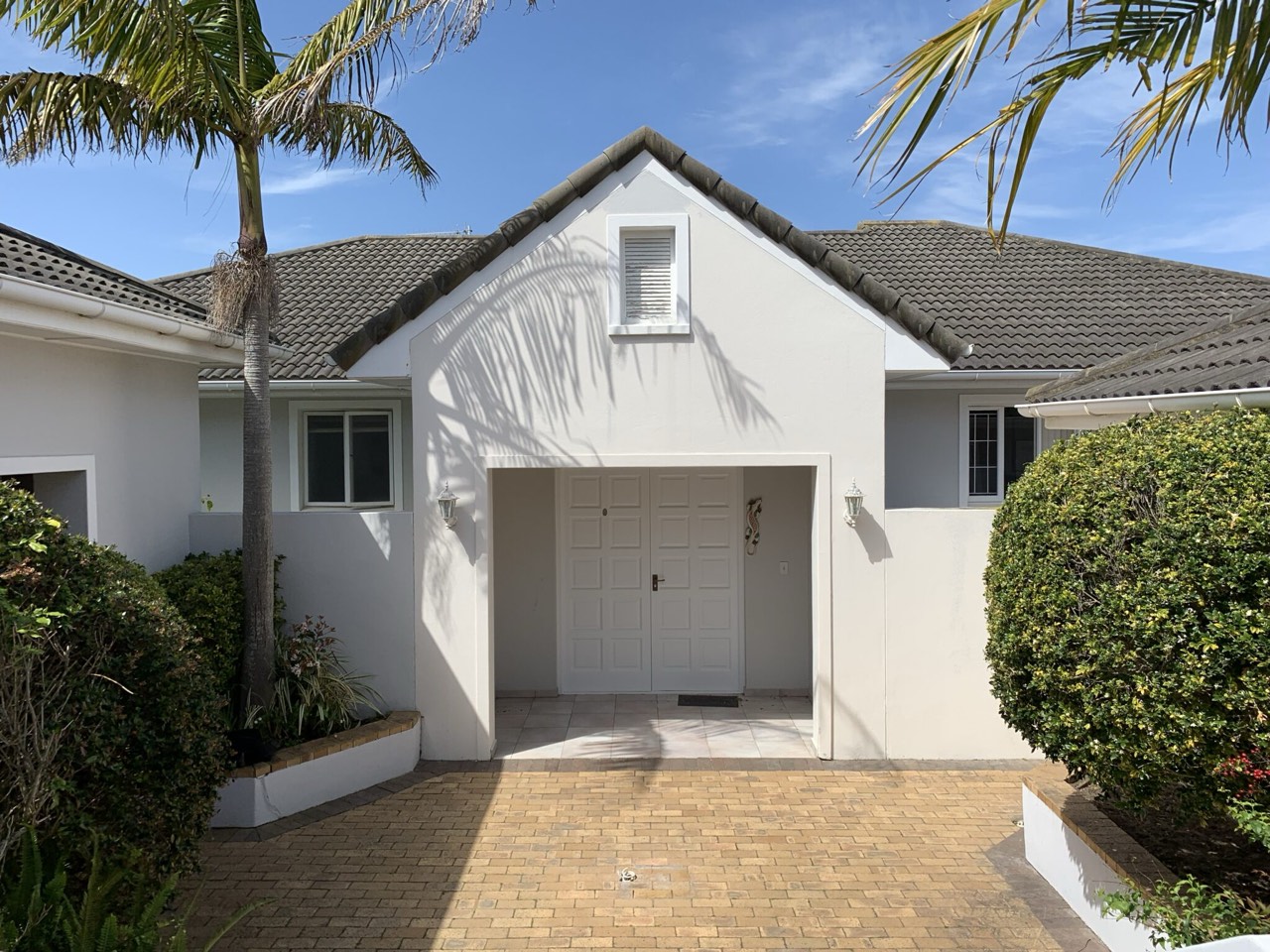 Front entrance and paved driveway