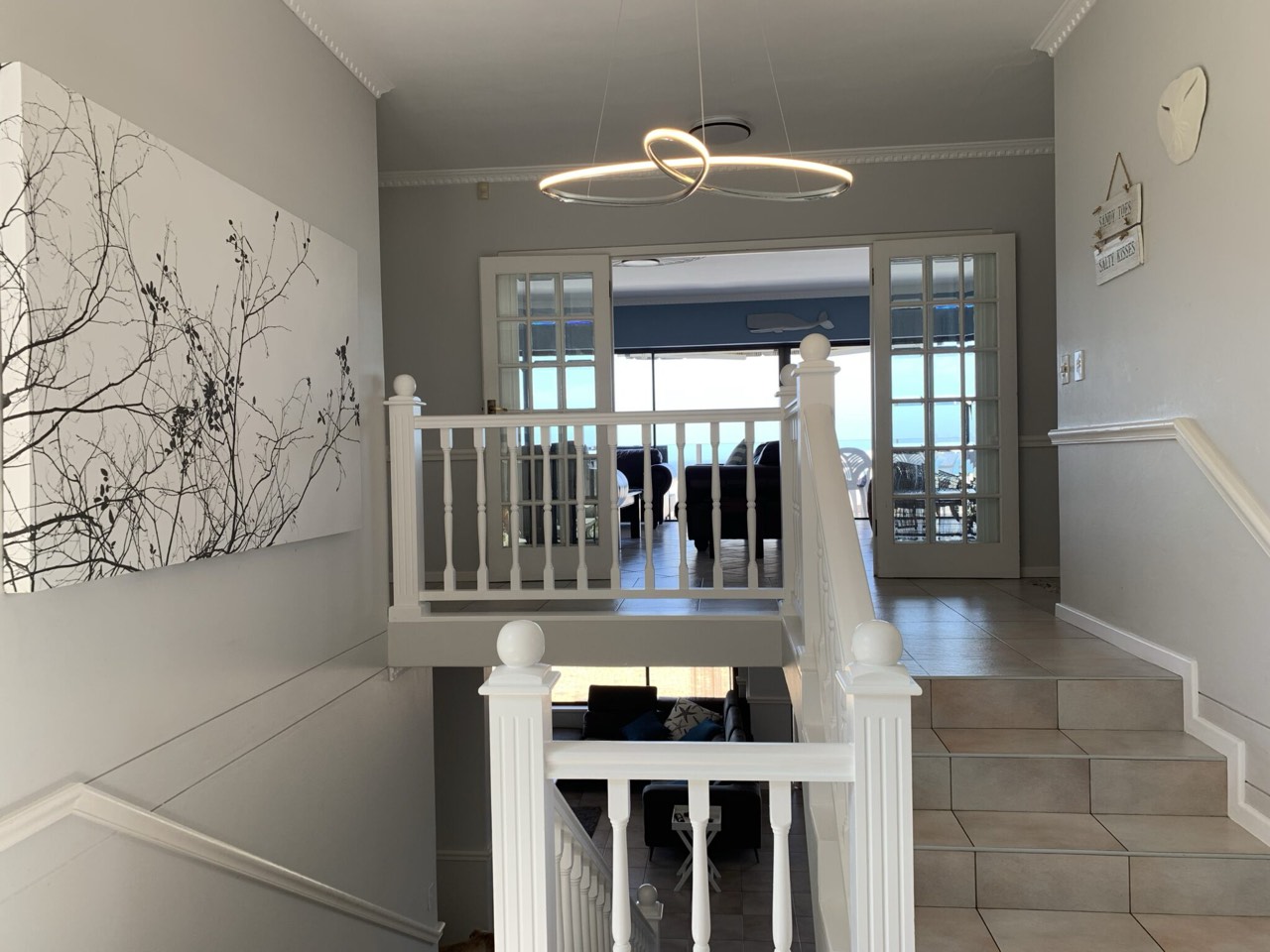 Staircase leading down to the open-plan living area